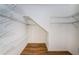 Walk-in closet with multiple tiers of metal shelving for maximum storage at 15925 Pond Rush Ct, Land O Lakes, FL 34638