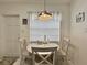 Bright dining area featuring white marble floors, dining set, and natural light at 1731 W Perio St, Tampa, FL 33612