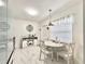Bright dining area featuring white marble floors, dining set, and natural light at 1731 W Perio St, Tampa, FL 33612