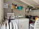 A well-organized laundry room offers ample shelving and appliances for efficient home care at 1731 W Perio St, Tampa, FL 33612