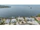 Beautiful aerial of waterfront homes with stunning views and docks for convenient boating access to open water at 200 Driftwood W Dr, Palm Harbor, FL 34683