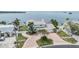 Stunning waterfront property with lush landscaping and charming curb appeal at 200 Driftwood W Dr, Palm Harbor, FL 34683