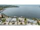 Aerial view of waterfront neighborhood, showcasing the idyllic location and beautiful Tampa Bay backdrop at 200 Driftwood W Dr, Palm Harbor, FL 34683
