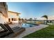 Enjoy outdoor living with a private pool and waterfront views from the backyard at 200 Driftwood W Dr, Palm Harbor, FL 34683