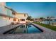 Waterfront backyard with a pool and private dock; perfect for entertaining at 200 Driftwood W Dr, Palm Harbor, FL 34683