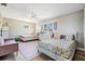 Bedroom featuring two beds, modern ceiling fan, hardwood floors and large window at 200 Driftwood W Dr, Palm Harbor, FL 34683