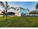 Beautiful backyard with a jungle gym and lush lawn at 200 Driftwood W Dr, Palm Harbor, FL 34683