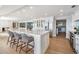 Open kitchen with large island, bar seating and stainless steel appliances at 200 Driftwood W Dr, Palm Harbor, FL 34683