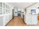 Bright kitchen with modern white cabinetry, stainless steel appliances, and blue backsplash at 200 Driftwood W Dr, Palm Harbor, FL 34683