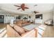 Open-concept living area with views of the kitchen and beautiful backyard water views at 200 Driftwood W Dr, Palm Harbor, FL 34683