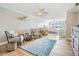 Large main bedroom featuring seating area, water views, and hardwood floors at 200 Driftwood W Dr, Palm Harbor, FL 34683