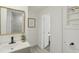 Stylish bathroom with a gold framed mirror and views into the shower room at 2111 E Ellicott St, Tampa, FL 33610