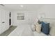 Bright bedroom showcasing a queen-size bed with soft pillows and natural light at 2111 E Ellicott St, Tampa, FL 33610