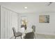 Cozy dining area featuring a round table, stylish gray chairs, and neutral wall decor at 2111 E Ellicott St, Tampa, FL 33610