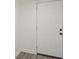 A sturdy white entryway door with contemporary black hardware at 2111 E Ellicott St, Tampa, FL 33610