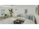 Inviting living room with neutral color palette, comfortable seating, and contemporary decor at 2111 E Ellicott St, Tampa, FL 33610
