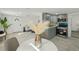 Open concept living space showcasing the dining area, living room, and modern kitchen at 2111 E Ellicott St, Tampa, FL 33610