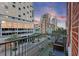City balcony view featuring surrounding buildings and colorful sky in the background at 215 Central Ave # 4H, St Petersburg, FL 33701