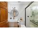 Charming bathroom featuring modern fixtures, a wood vanity, and tiled shower at 215 Central Ave # 4H, St Petersburg, FL 33701