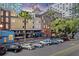 City street view of an apartment building with parking and commercial spaces at 215 Central Ave # 4H, St Petersburg, FL 33701