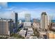 Breathtaking cityscape with towering buildings against a bright blue sky and distant ocean horizon at 215 Central Ave # 4H, St Petersburg, FL 33701