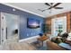 Comfortable living room with brick accent wall and hardwood floors at 215 Central Ave # 4H, St Petersburg, FL 33701