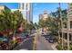 Scenic street view featuring tree-lined streets, parked cars, and tall buildings in a vibrant city setting at 215 Central Ave # 4H, St Petersburg, FL 33701