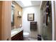 Bathroom featuring a vanity, toilet, glass door shower, and tiled floor at 229 Tazewell Dr, Port Charlotte, FL 33954