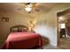 Bedroom with a ceiling fan, and access to the living room at 229 Tazewell Dr, Port Charlotte, FL 33954