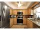 Well-equipped kitchen featuring stainless steel appliances, granite countertops, and ample cabinet space at 229 Tazewell Dr, Port Charlotte, FL 33954