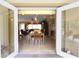 Bright living room area that connects to dining area and features a view to the backyard at 229 Tazewell Dr, Port Charlotte, FL 33954