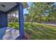 Large backyard with grass, mature trees and shadows in a park-like setting at 2807 W Granfield Ave, Plant City, FL 33563