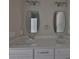 Bright bathroom with double vanity, modern sinks, and stylish mirrors at 2807 W Granfield Ave, Plant City, FL 33563
