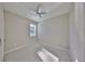 Bedroom featuring a ceiling fan, plank flooring, and natural light from the window at 2807 W Granfield Ave, Plant City, FL 33563