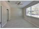 Bright, airy bedroom with large window and neutral paint and tile at 2807 W Granfield Ave, Plant City, FL 33563