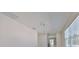 Bright, neutral interior featuring elegant chandelier and a clear view into other rooms at 2807 W Granfield Ave, Plant City, FL 33563