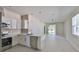 Modern kitchen featuring stainless steel appliances, white cabinets, and an open-concept design at 2807 W Granfield Ave, Plant City, FL 33563