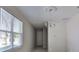 Chandelier and large window give lots of light to the the living room at 2807 W Granfield Ave, Plant City, FL 33563