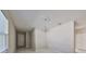 Chandelier lights up an expansive room with large windows at 2807 W Granfield Ave, Plant City, FL 33563