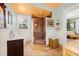 Bathroom featuring a tiled walk-in shower, decorative fixtures, a window, and brown vanity at 3000 2Nd N Ave, St Petersburg, FL 33713