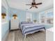 Bedroom featuring a ceiling fan, wood floors, and multiple windows offering lots of natural light at 3000 2Nd N Ave, St Petersburg, FL 33713