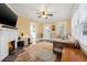 Cozy living room featuring hardwood floors, a fireplace, and a comfortable seating area at 3000 2Nd N Ave, St Petersburg, FL 33713