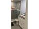 Bathroom featuring a sleek glass-enclosed shower with updated fixtures and white vanity at 3106 W Dewey, Tampa, FL 33607