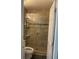 Bathroom featuring a sleek glass-enclosed shower with updated fixtures and neutral tile at 3106 W Dewey, Tampa, FL 33607