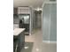 Hallway view of the kitchen and the stainless steel refrigerator at 3106 W Dewey, Tampa, FL 33607