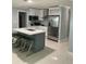 Bright kitchen with an island, quartz countertops, stainless steel appliances, and white cabinets at 3106 W Dewey, Tampa, FL 33607