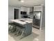 Stylish kitchen featuring an island, quartz countertops and stainless steel appliances at 3106 W Dewey, Tampa, FL 33607