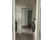 A laundry room with two modern washing machines and open storage space at 3106 W Dewey, Tampa, FL 33607