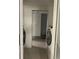 A laundry room with two modern washing machines and open storage space at 3106 W Dewey, Tampa, FL 33607