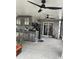 Outdoor kitchen with stainless steel appliances, stone accents, and ceiling fans at 3106 W Dewey, Tampa, FL 33607